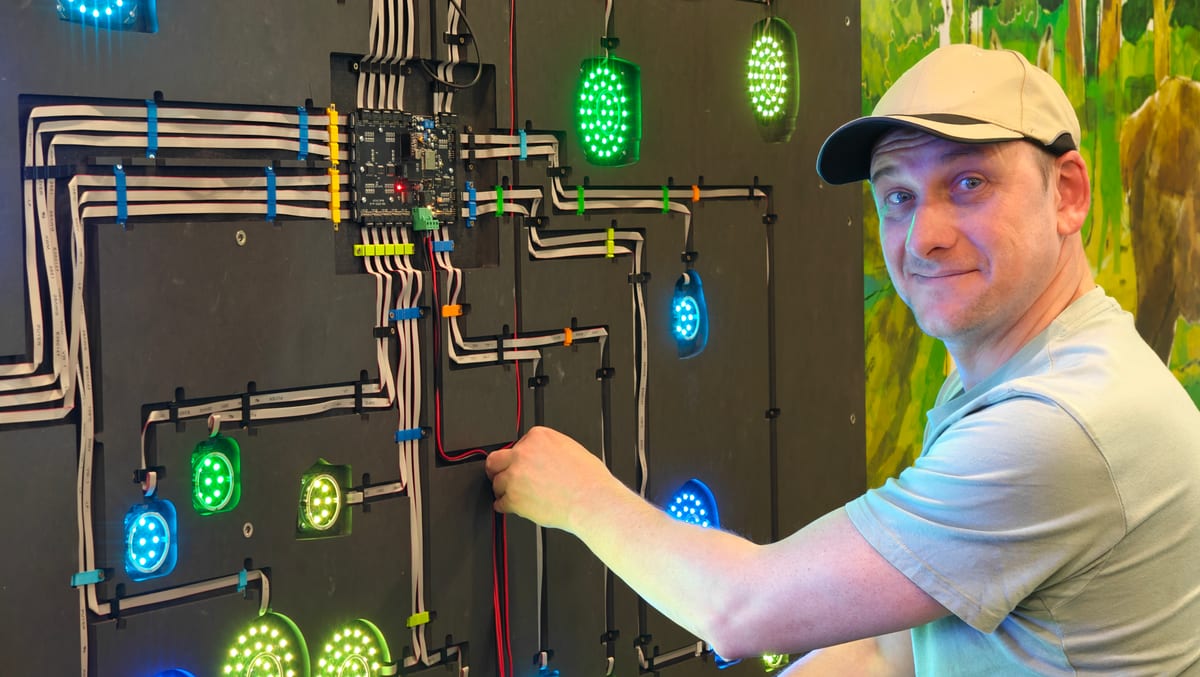 Technician wiring LED panel
